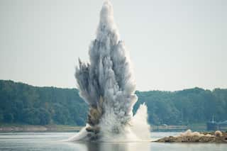 Water explodes due to an underwater detonation