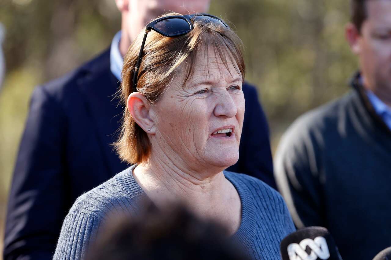 A woman speaking to media