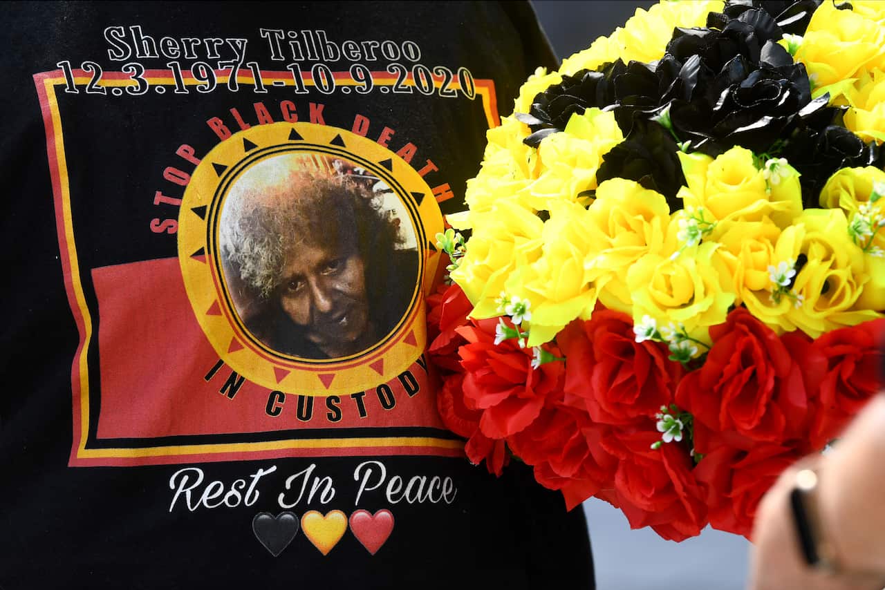 Kathy Brady wears a shirt in honour of her sister Shiralee Tilberoo, as she speaks during a press conference ahead of the inquest into the death in custody of Shiralee Deanne Tilberoo, Brisbane Coroners Court, in Brisbane, Thursday, August 25, 2022. 