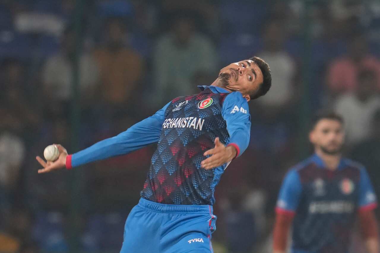 Afghanistan's Mujeeb ur Rahman bowls a delivery during the ICC Men's Cricket World Cup match between Afghanistan and England in New Delhi, India, on Sunday, 15 October 2023.