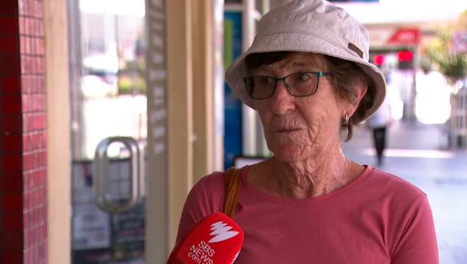 Woman being interviewed in the street 