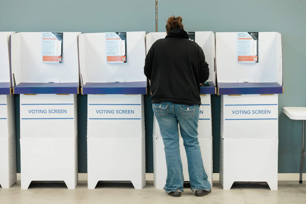 A person voting at polling booth