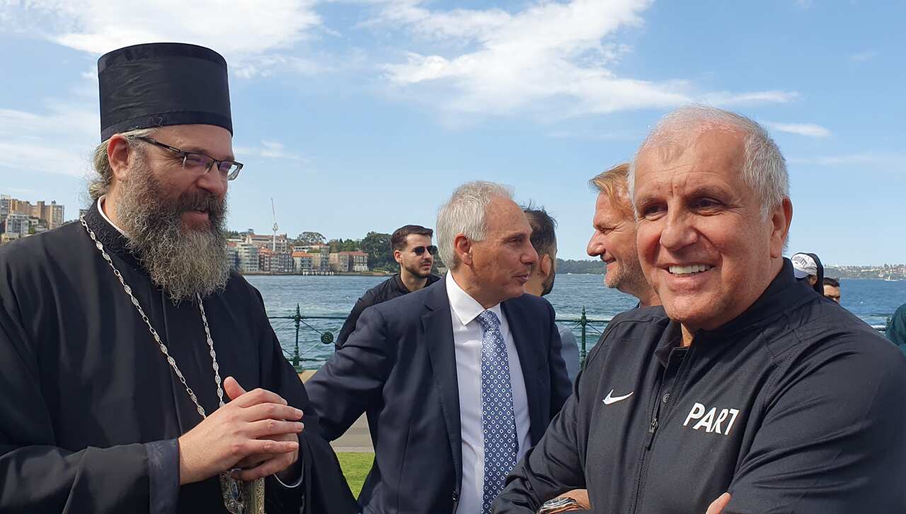 Partizan Basketball Club coach Zeljko Obradovic talks to His Grace Bishop Siluan, Serbian Orthodox Church Metropolitan for Australia and New Zealand