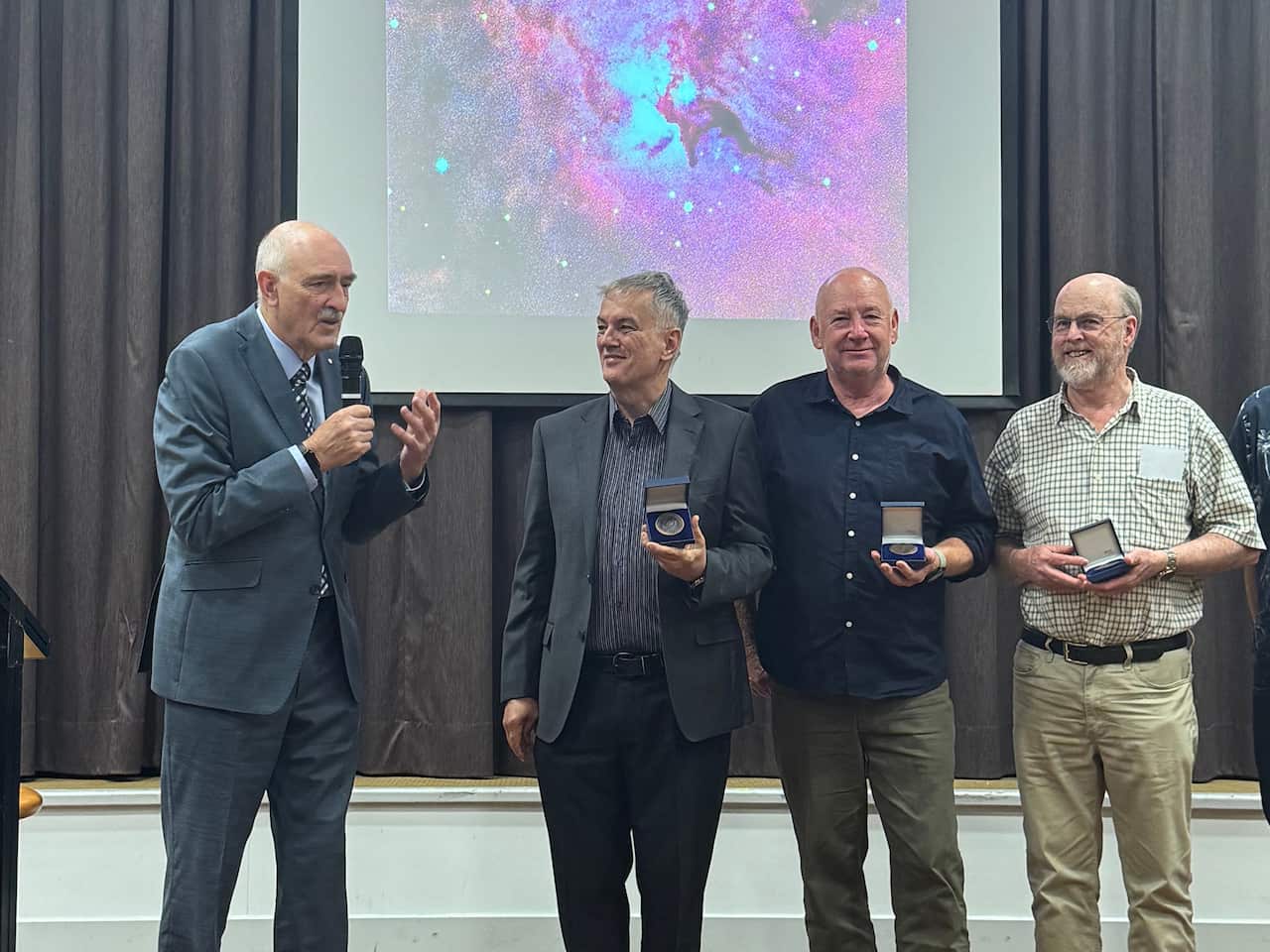 Fred (left) presents Page medal to Renato, Jonathan and Chris - Edited.jpg