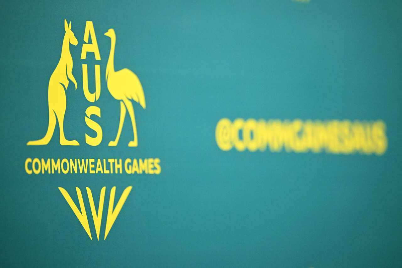 A green and yellow banner promoting the 2026 Commonwealth Games.