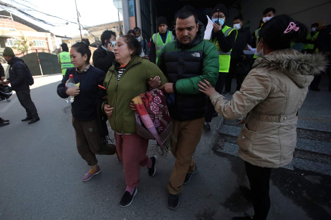 Relatives of a crashed passenger plane at Katmandhu airport, Nepal.