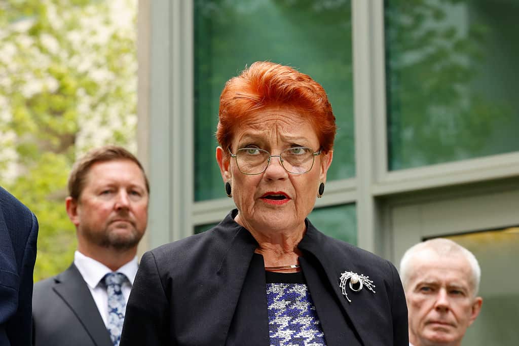 Pauline Hanson standing outside talking 