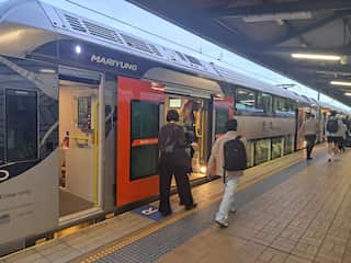 Passengers boarding a train.