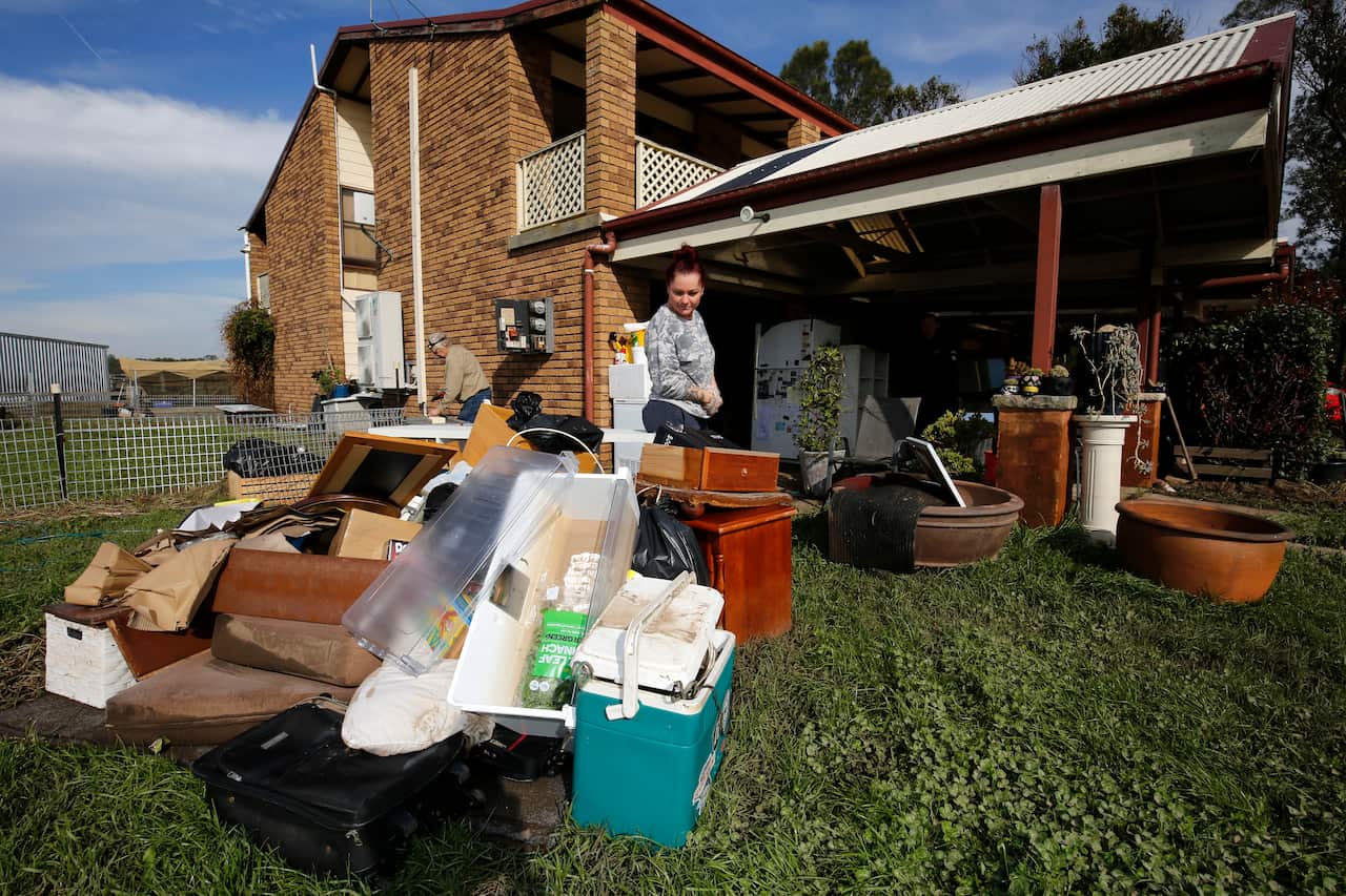 Debris outside a house after flooding.