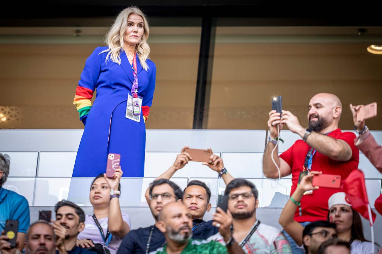 Former Danish Prime Minister Helle Thorning-Schmidt, with rainbow coloured sleeves on her outfit while watching the FIFA World Cup 2022.