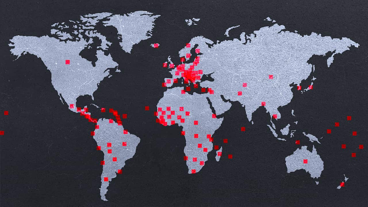A map of the world with red markers. 