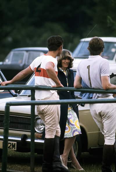 Prince Charles and Camilla Parker Bowles chat at a polo match