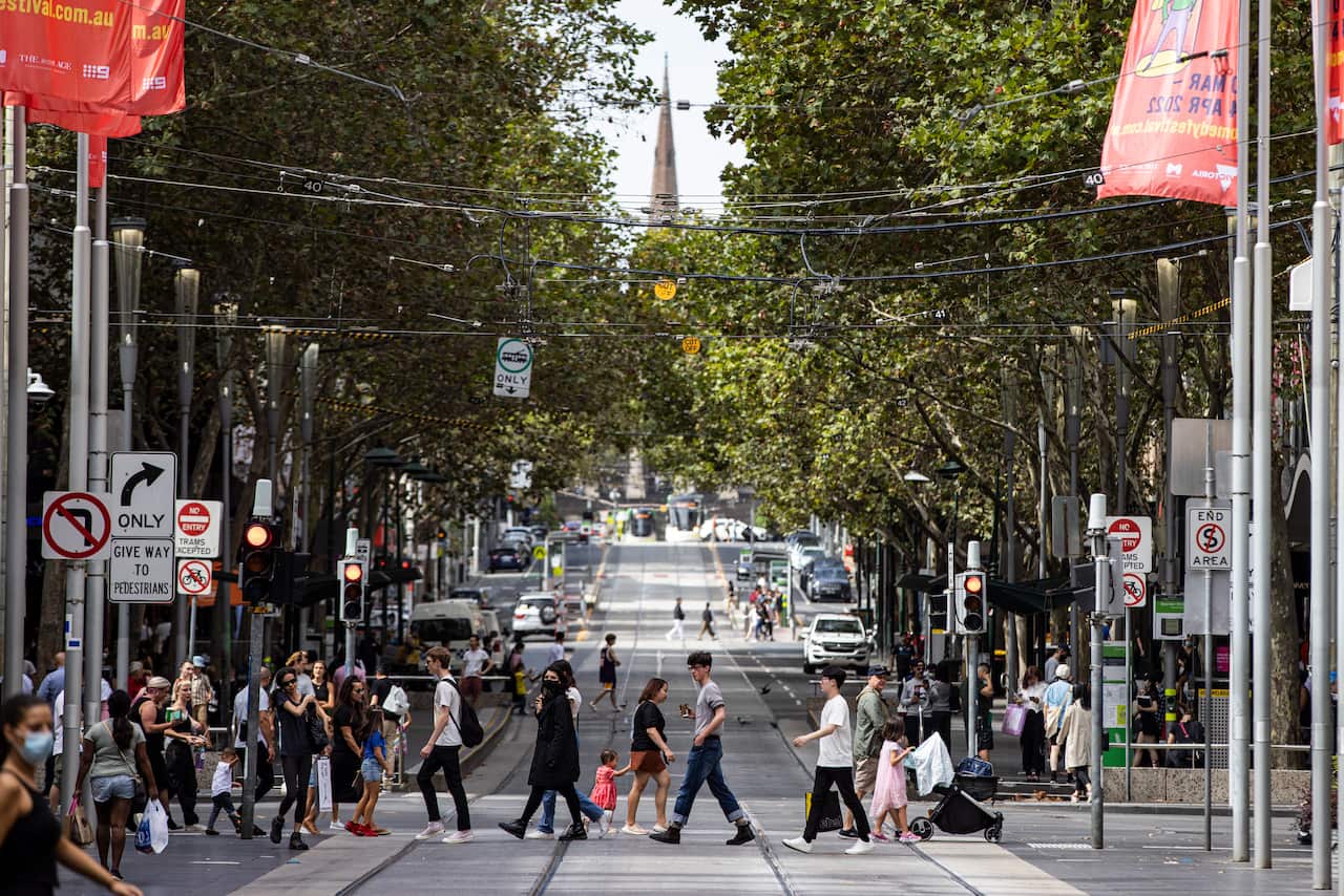People crossing an intersection in Melbourne's CBD.