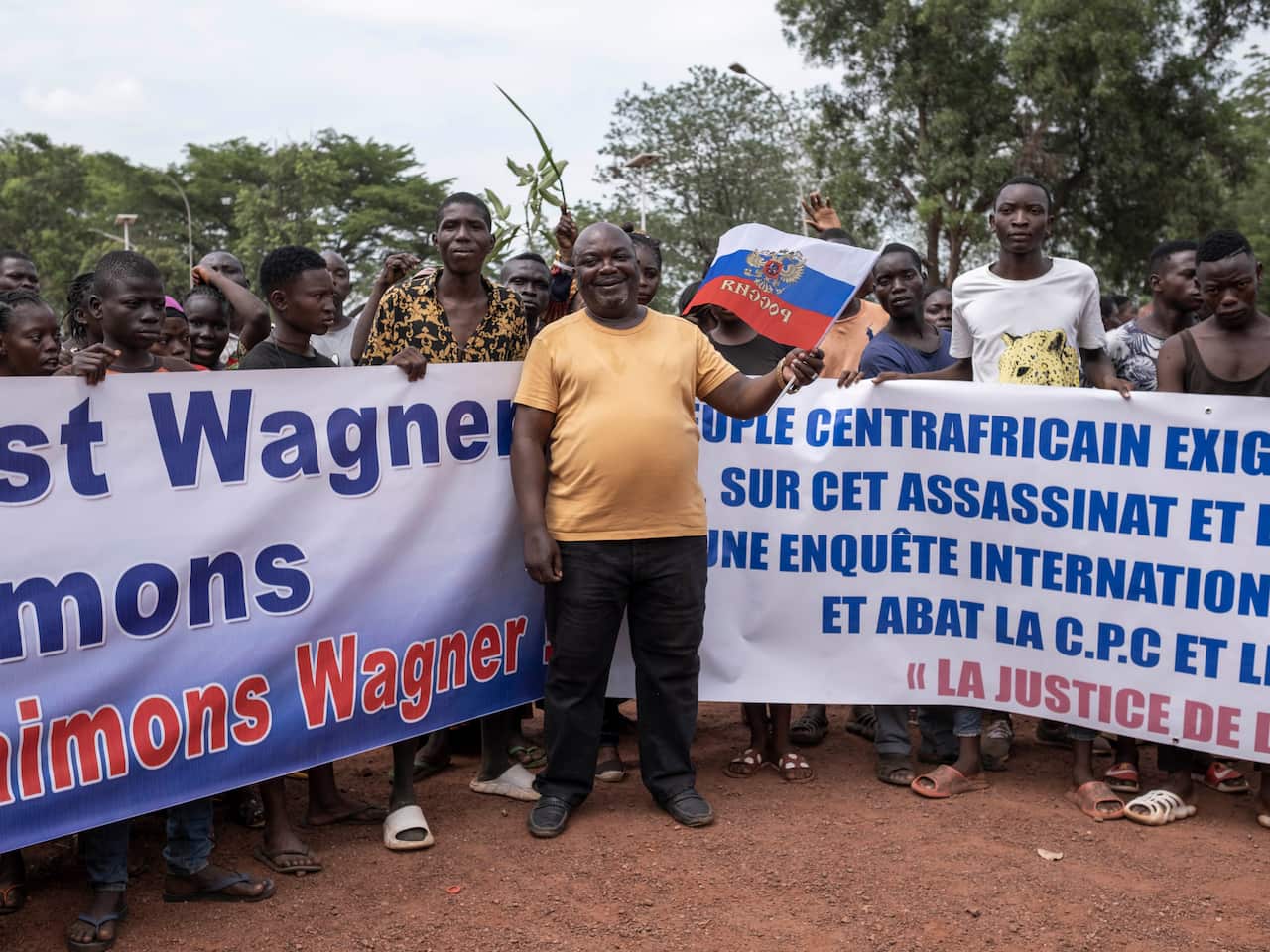 People hold Russian flags and banners during a pro Russia demonstration in the Central African Republic