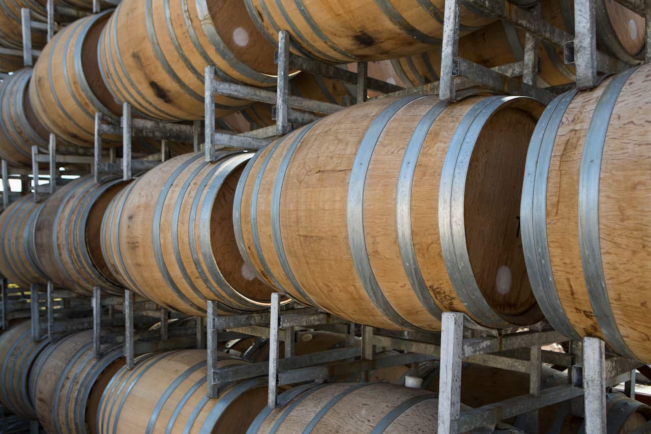 Wine barrels in shelves at cellar