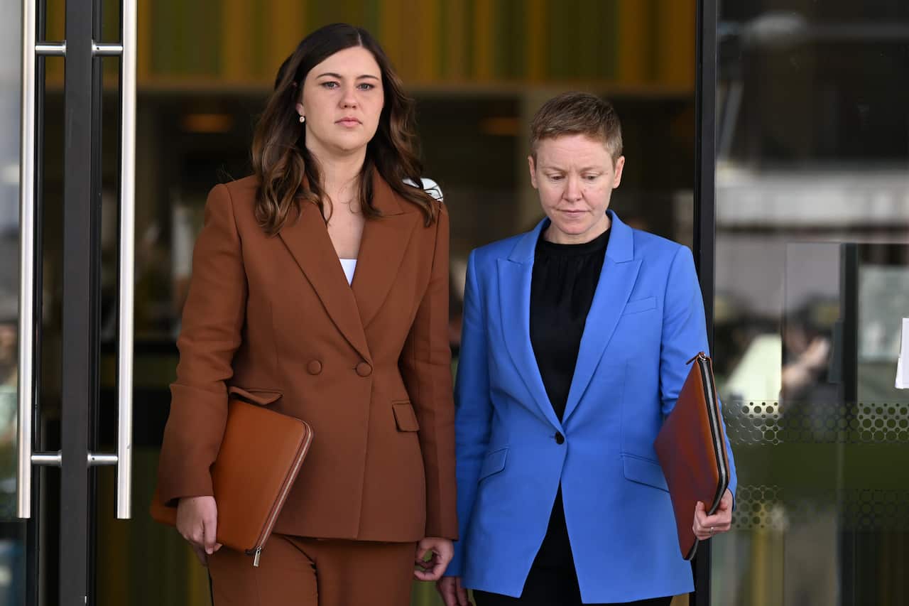 Two women in official suits