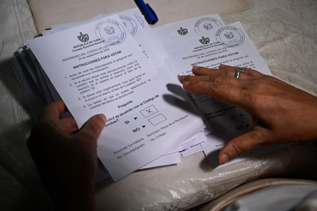 A member of the electoral authorities counts ballots at a polling station in Havana.