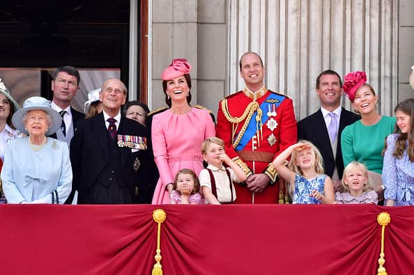 Members of the British Royal Family, including the Queen, stand on a balcony at Buckingham Palace in London.