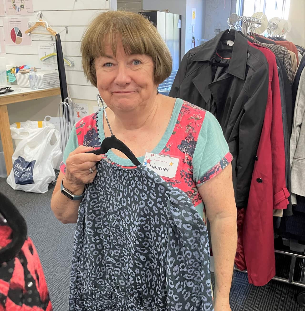 Volunteer Heather Davie in the Dress for Success store room.