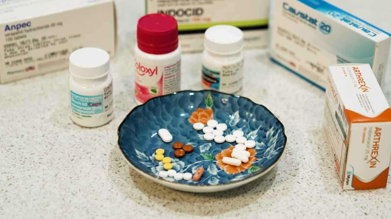 A small bowl with over 25 pills which Simon took to treat his cluster headaches. 