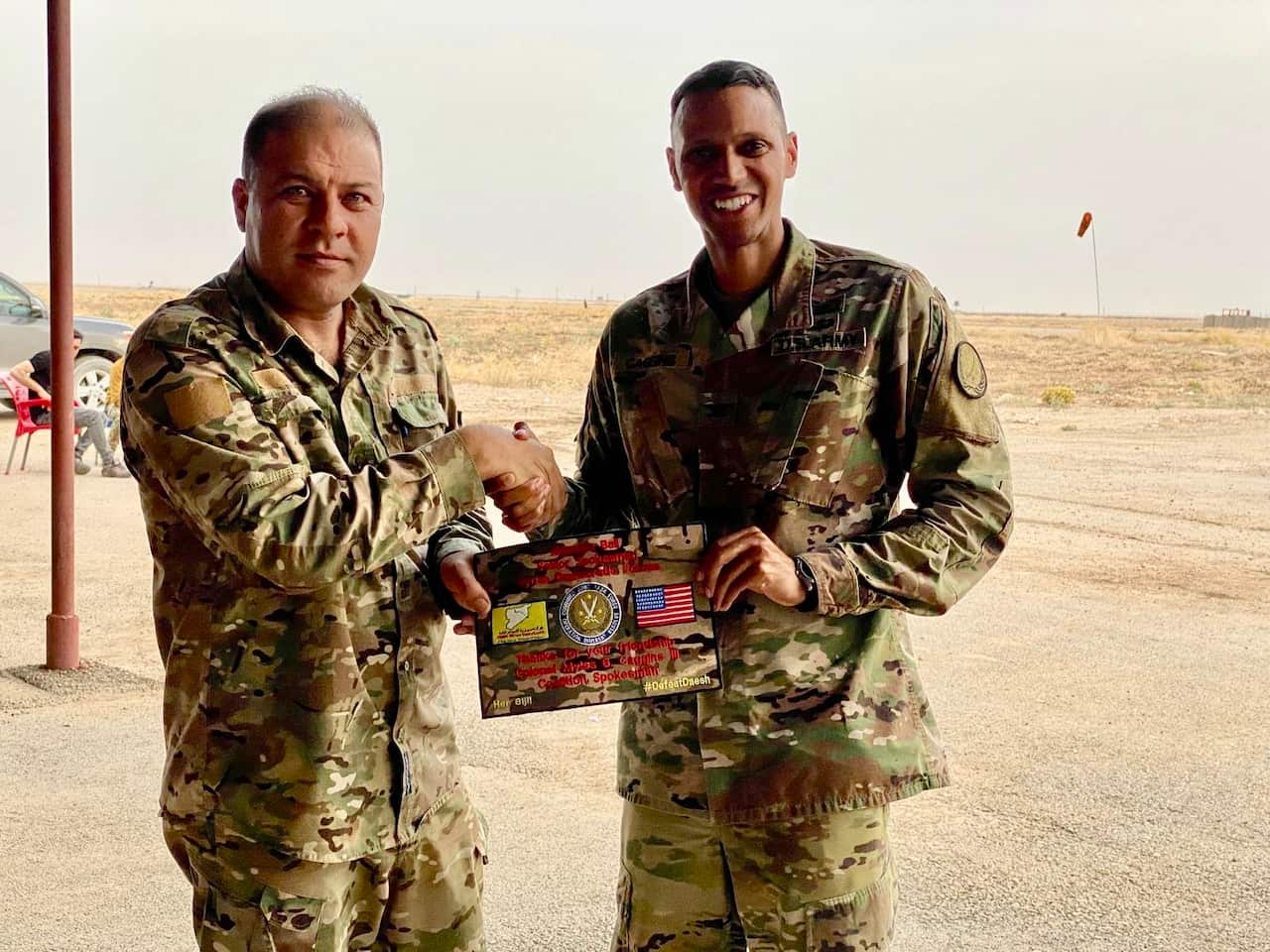 Myles Caggins and Mustafa Bali former media director SDF.jpeg