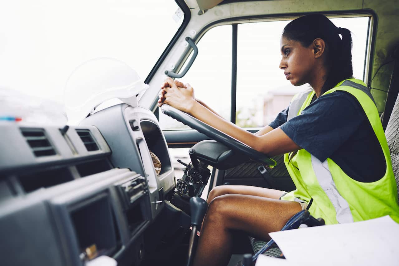 Construction workers in Australian in building site working and doing tasks.