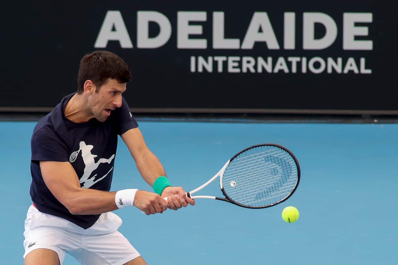 Novak Djokovic hitting a tennis ball 