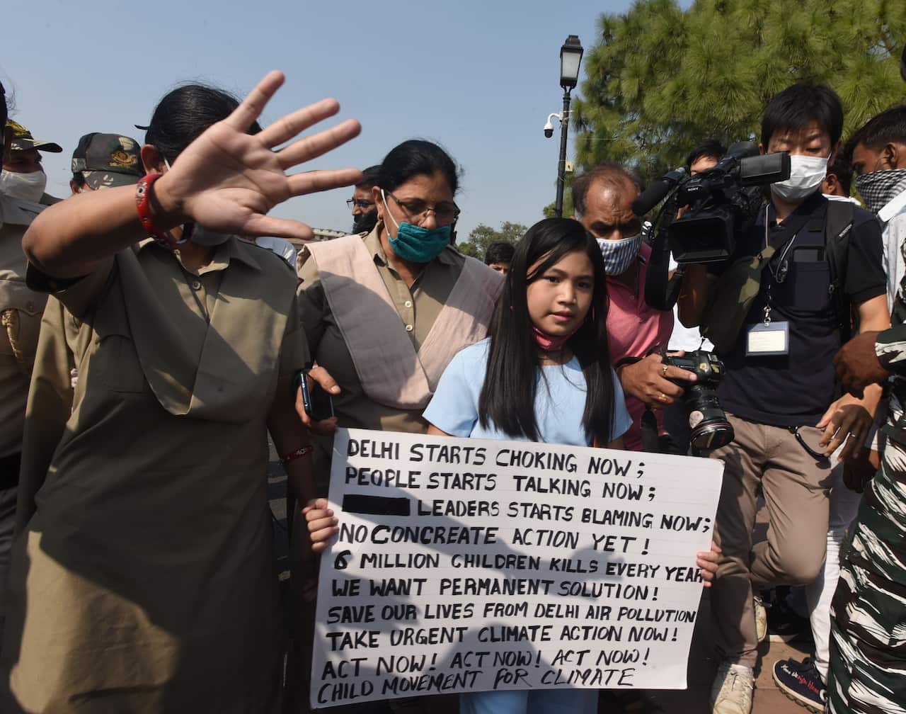 Climate Activist holding a sign.