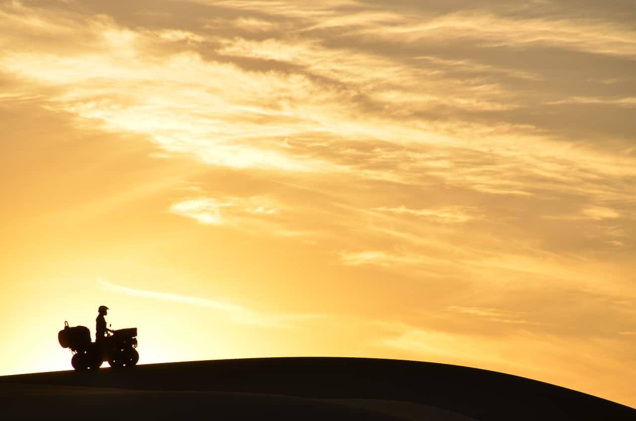 (archive) lone quad in silhouette on a hill 3 copia.jpg
