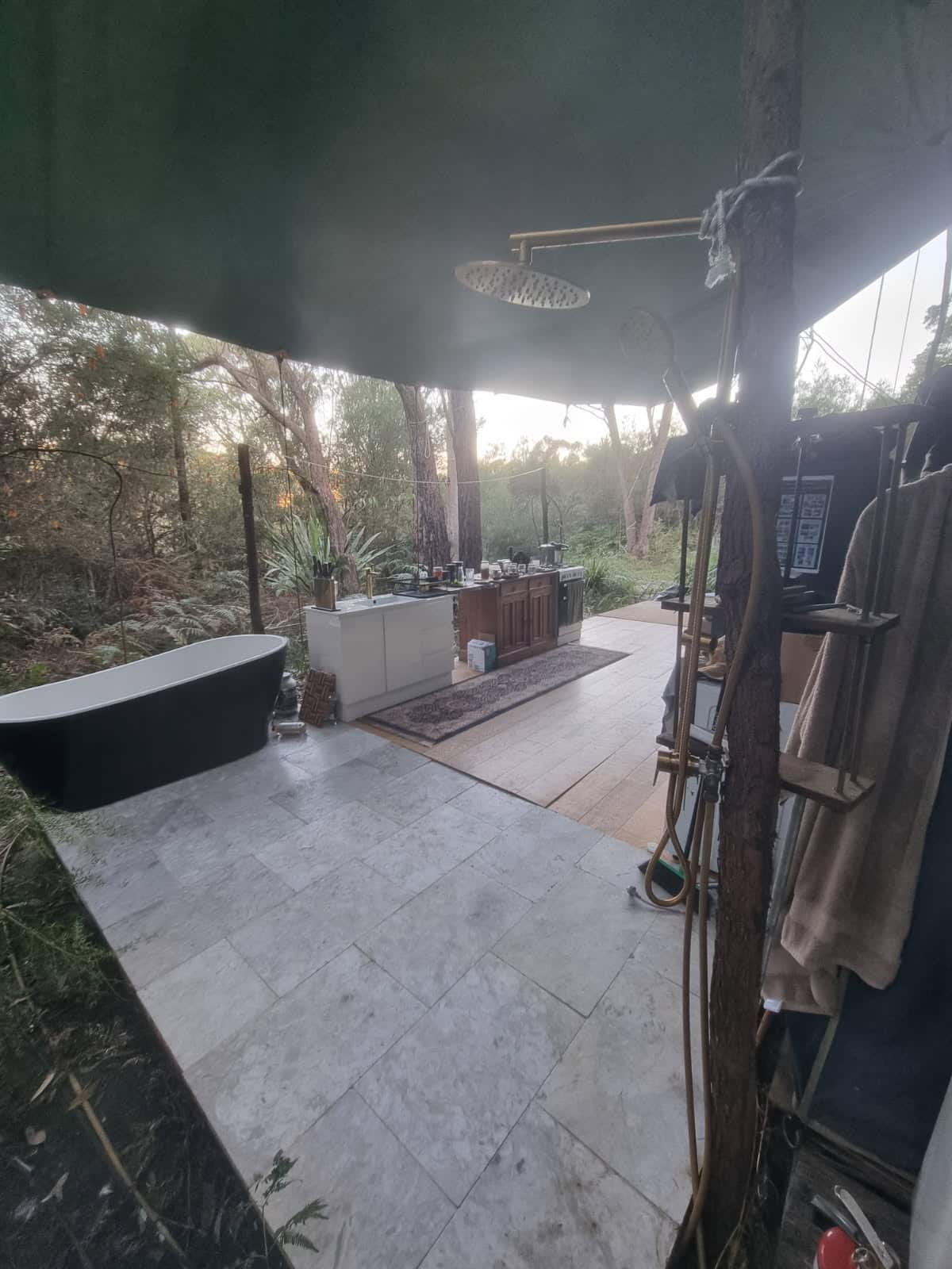 Marble tiles on an outdoor bathroom setup.