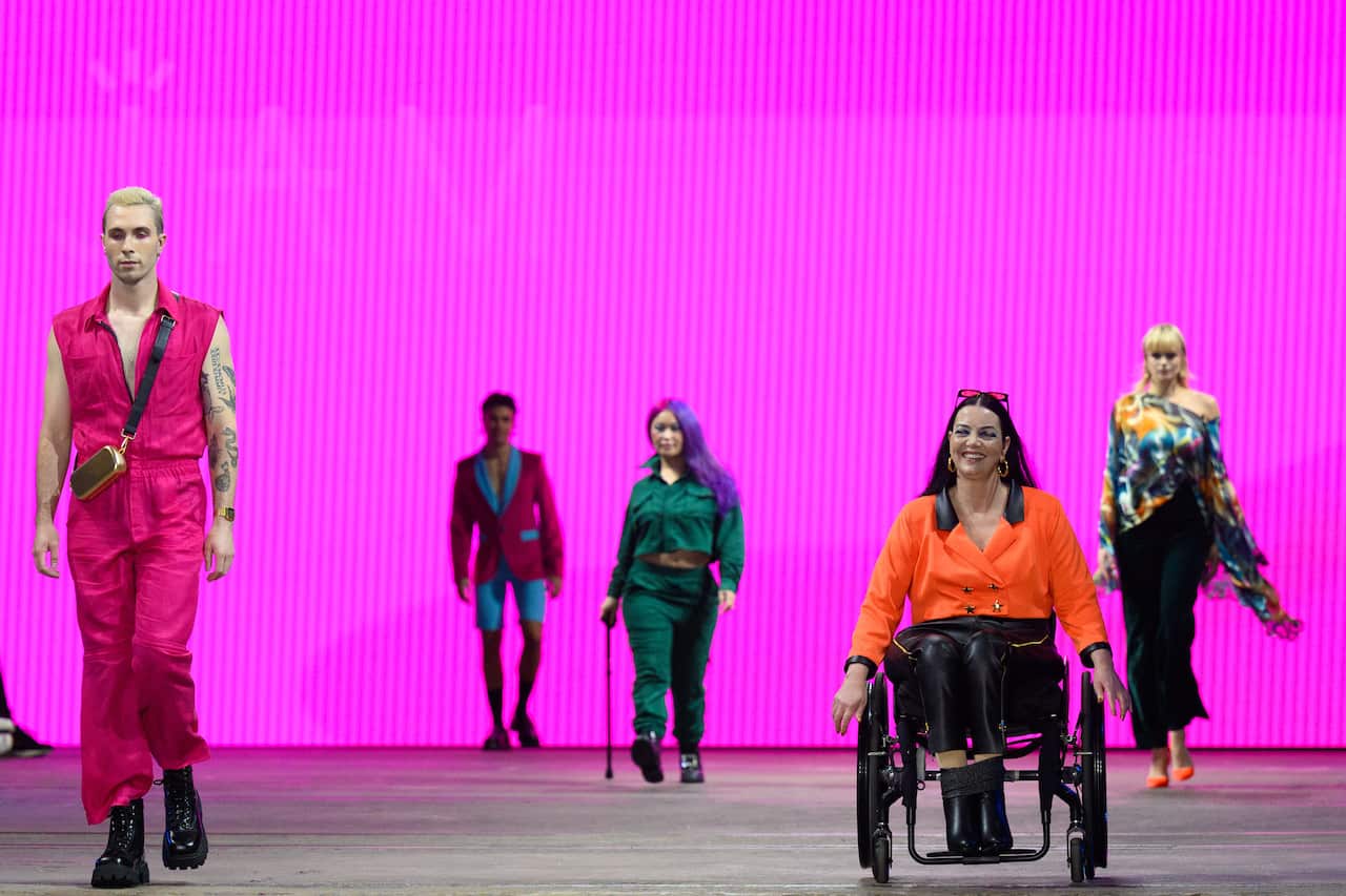 Group of models on the runway in the Adaptive Clothing Collective fashion show.