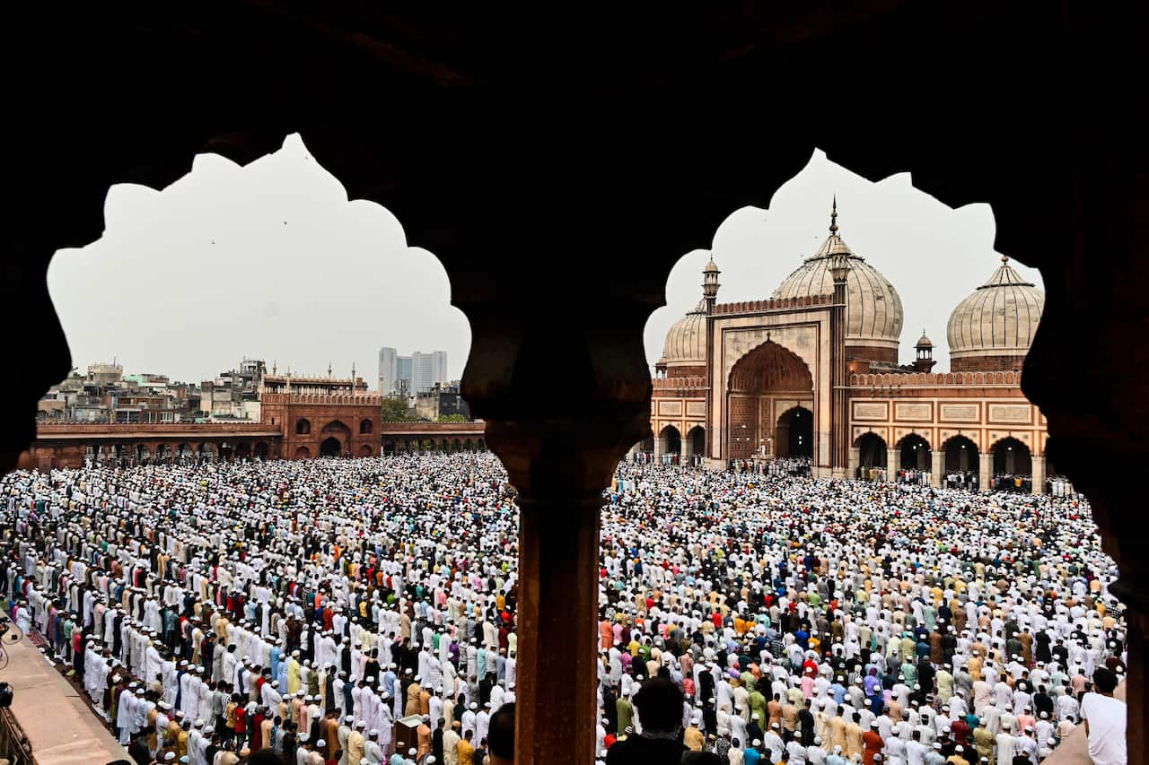 People pray at a mosque. 
