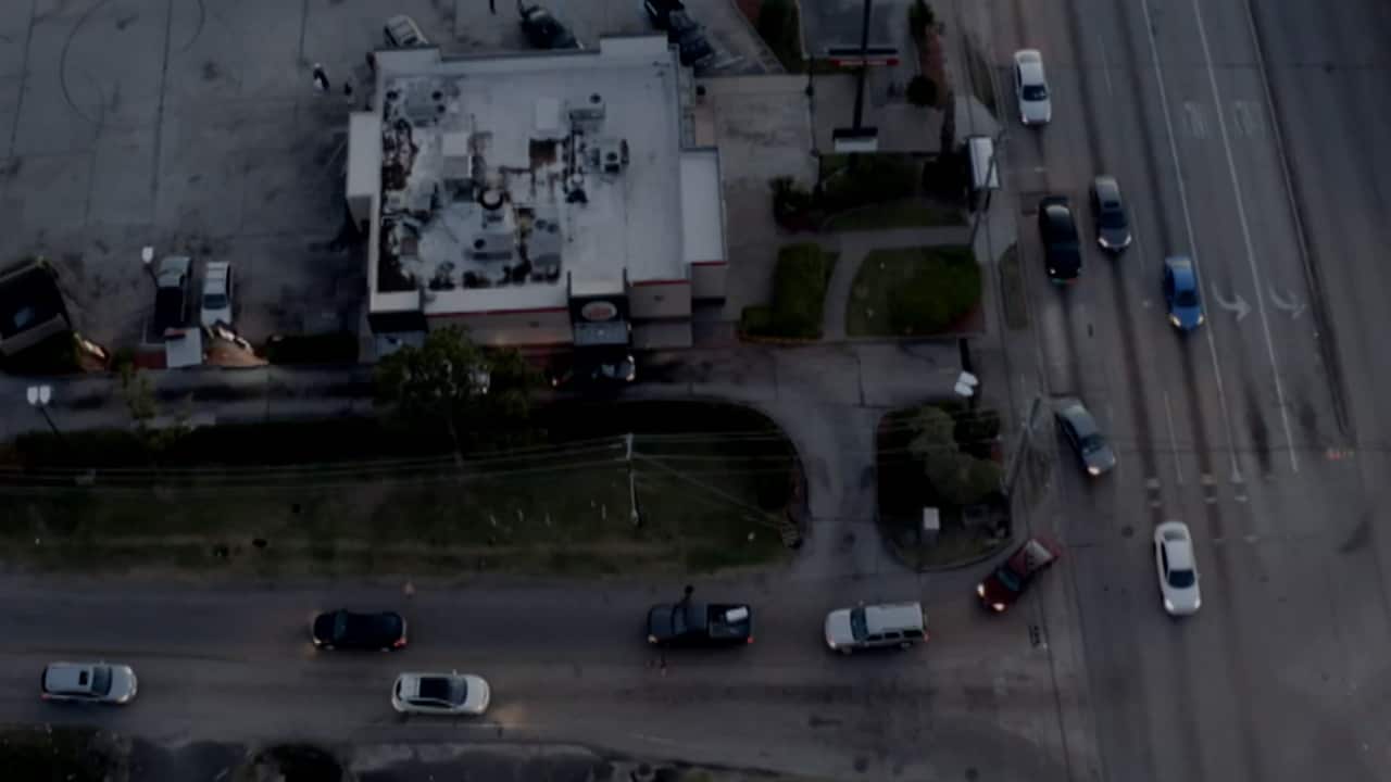 An aerial image showing cars circling a block.