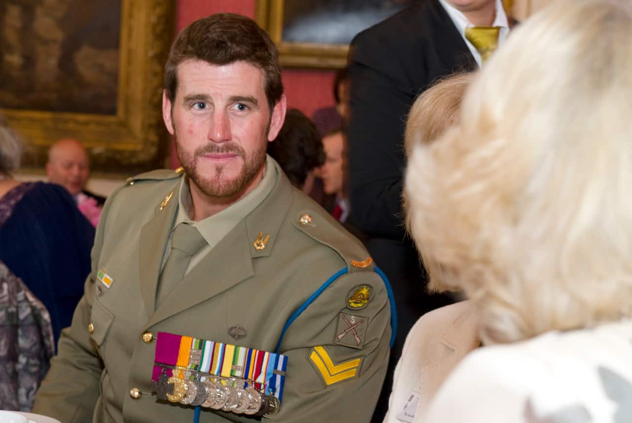 Ben Roberts-Smith VC speaks with The Duchess of Cornwall during a reception to celebrate military and civilian heroes