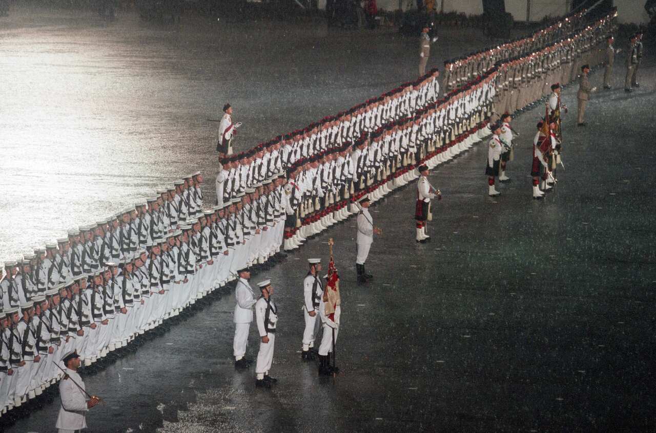 Troops perform ceremonial formalities in the rain