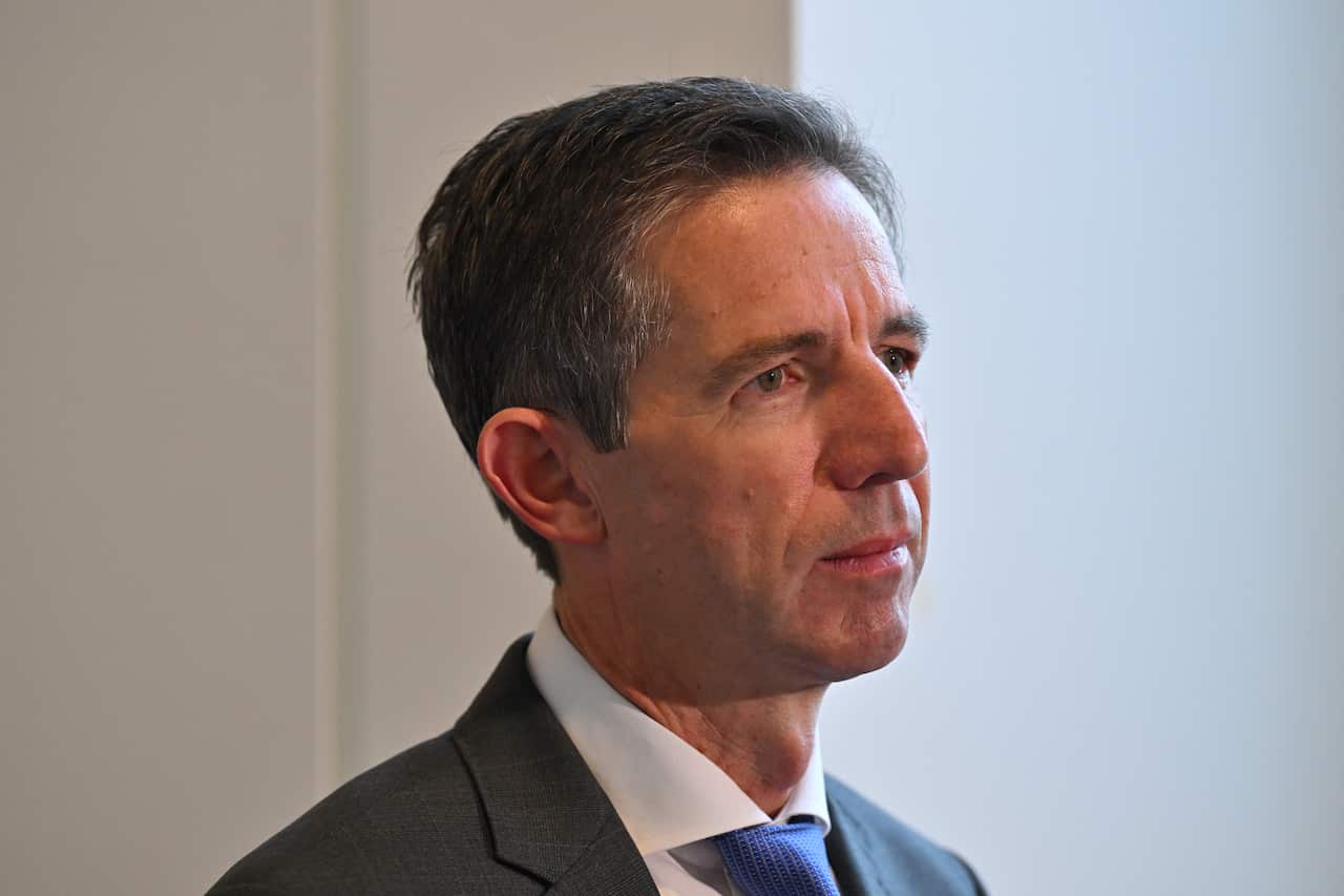 A man speaks at a press conference.