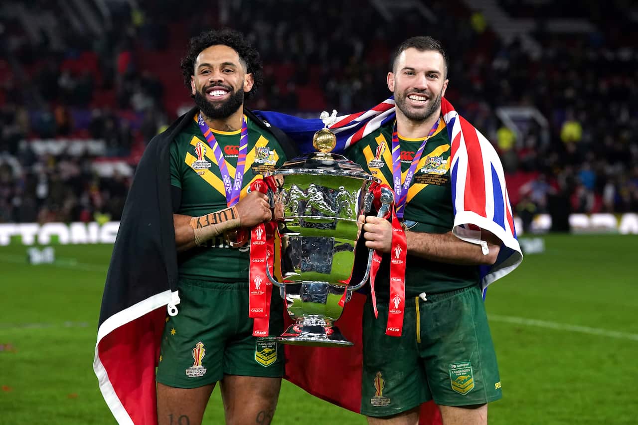 Josh Addo-Carr and James Tedesco celebrate with the cup