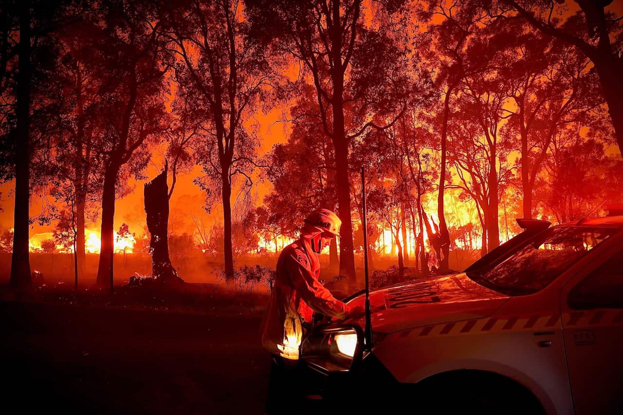 firefighters battling a bushfire in Bridgetown, Western Australia, 06 February 2022.