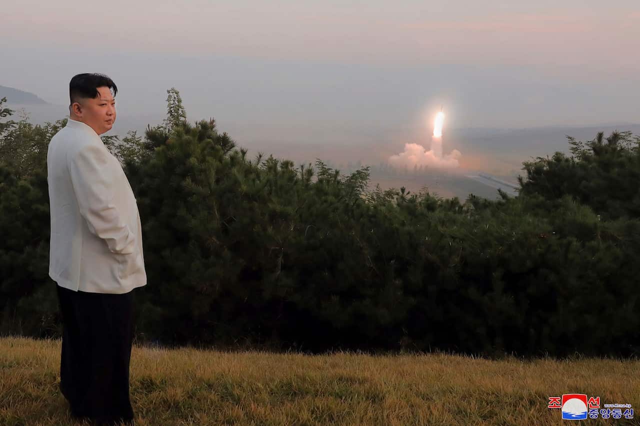 North Korean leader Kim Jong Un watches a missile test
