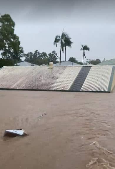 A shed underwater in floodwaters in Lismore