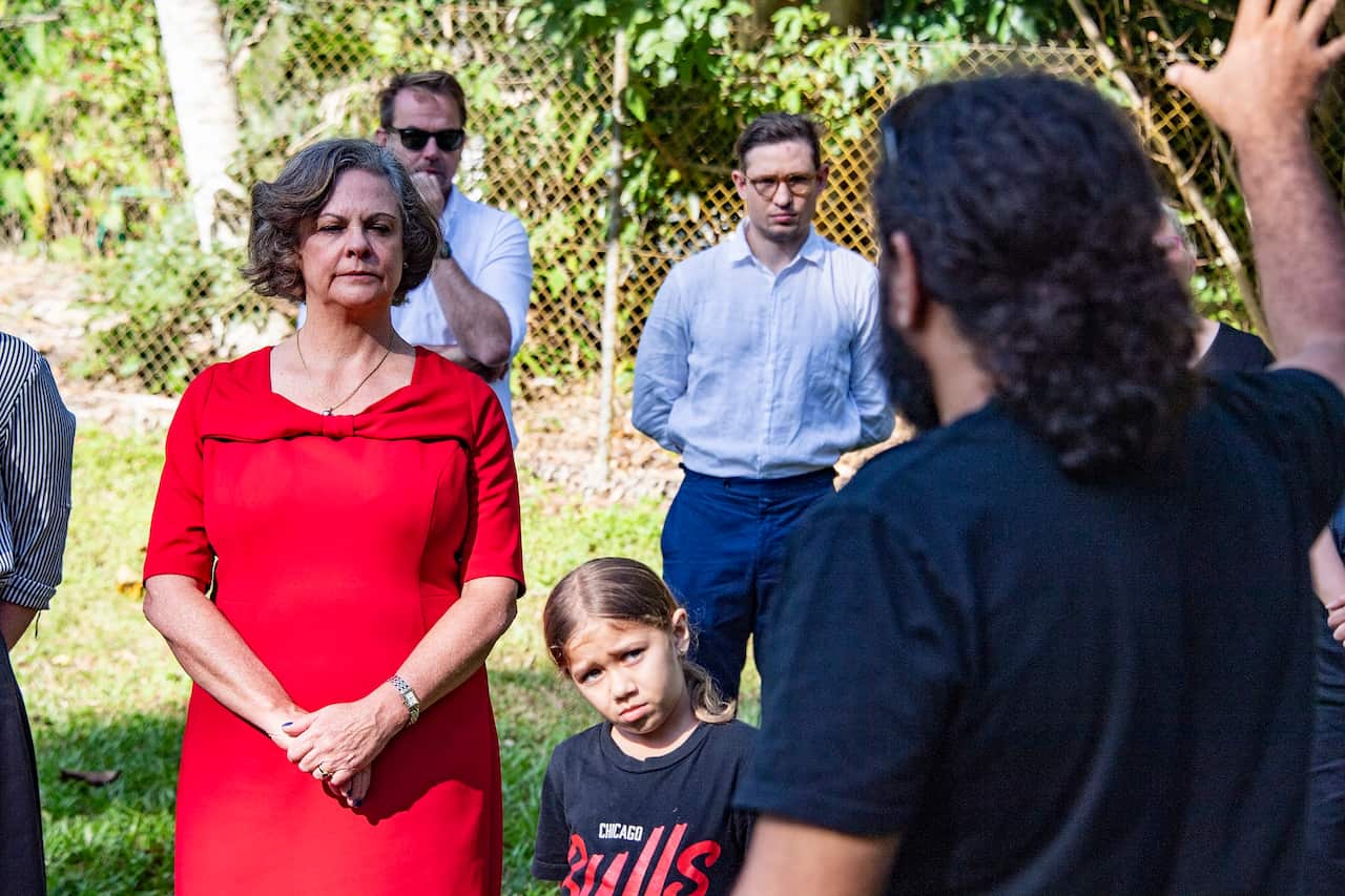 President of the Land Court of Queensland Fleur Kingham (left) observes the smoking ceremony as the court heard evidence on-country based on First Nations protocols on 31 May 2022. 