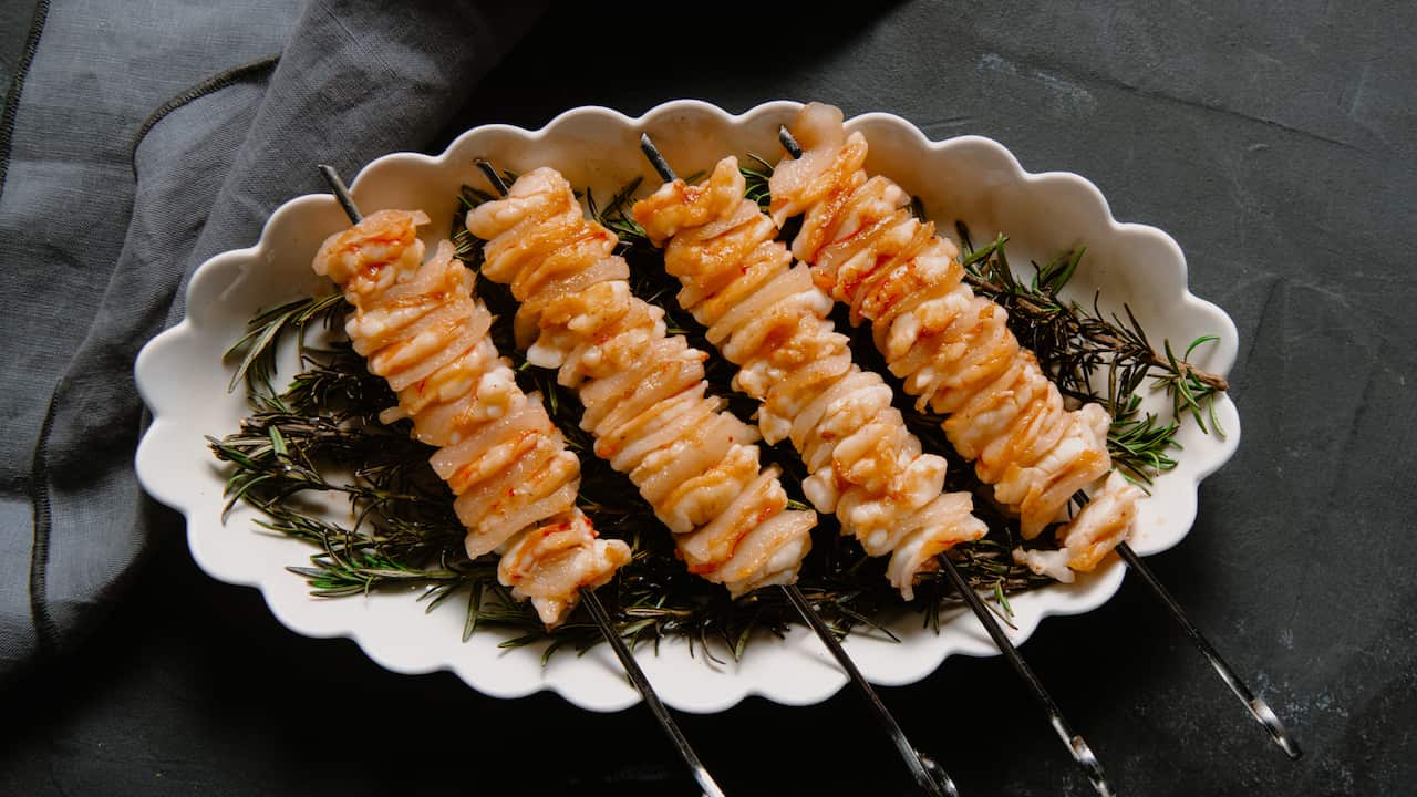 Tiger prawn and lardo skewers with smoked rosemary