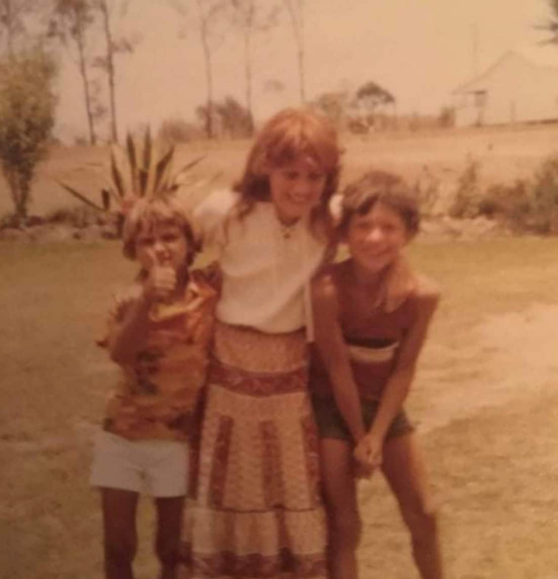 Andy Saunders as a young child (on left) with playing with other children