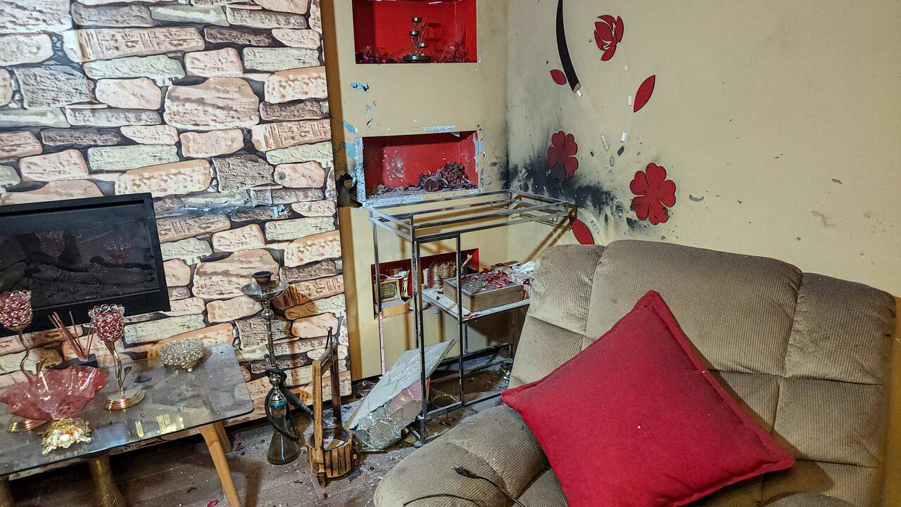 A living room damaged by device explosion