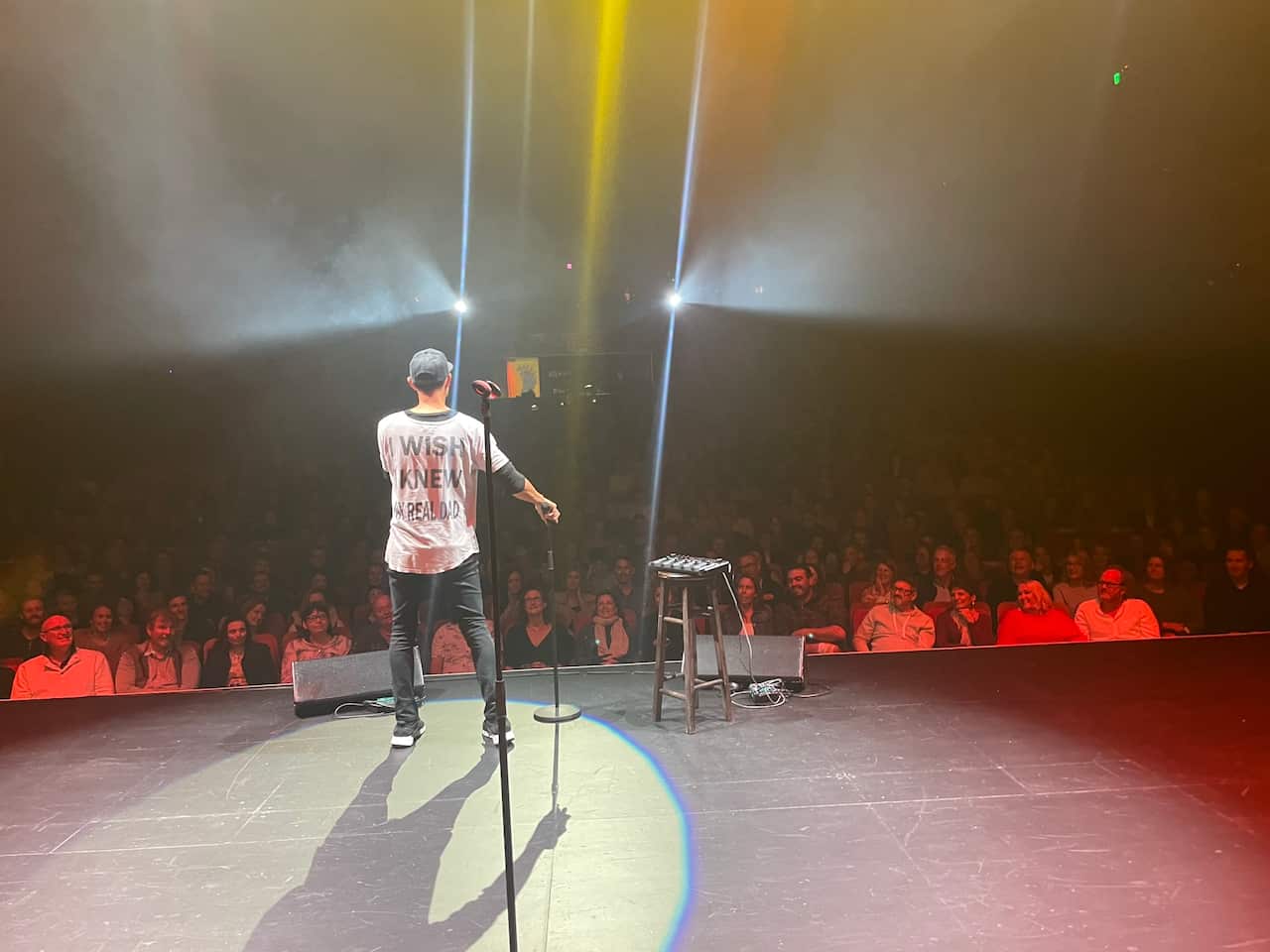 Comedian Andy Saunders performing comedy on stage