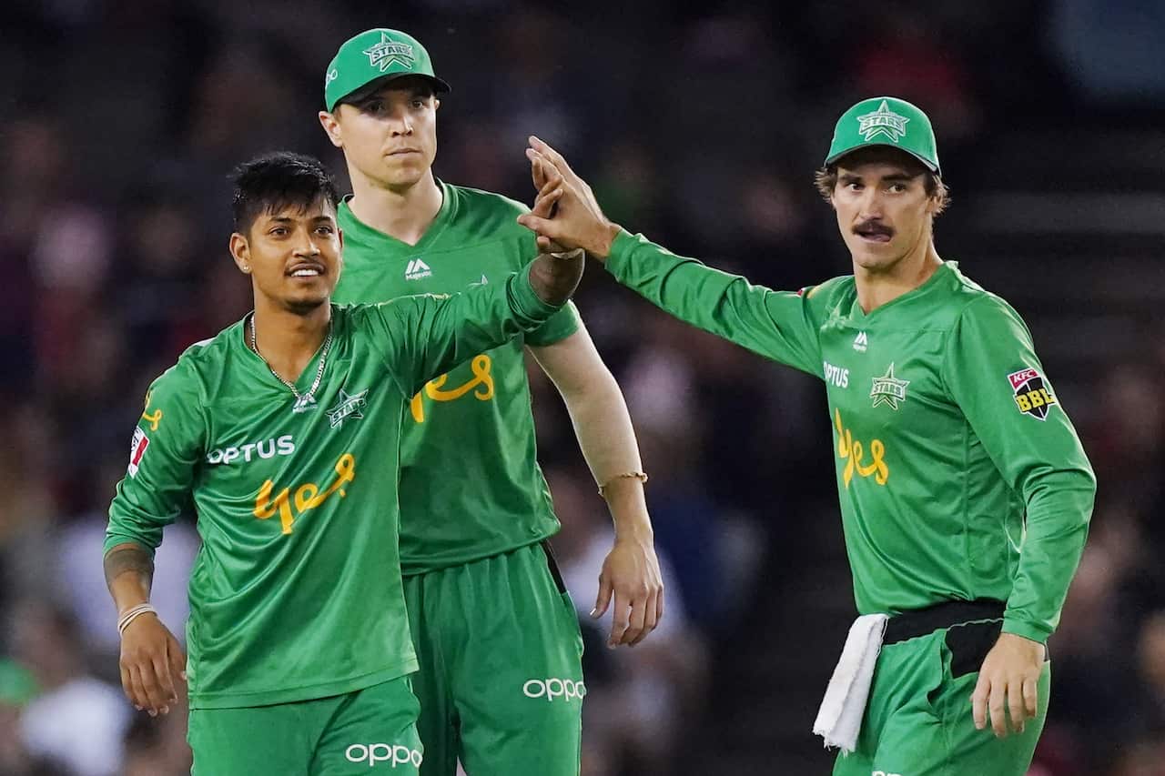 Sandeep Lamichhane of the Stars (left) celebrates a wicket during the Big Bash League (BBL) cricket match between the Melbourne Renegades and Melbourne Stars at Marvel Stadium in Melbourne, Friday, January 10, 2020. 