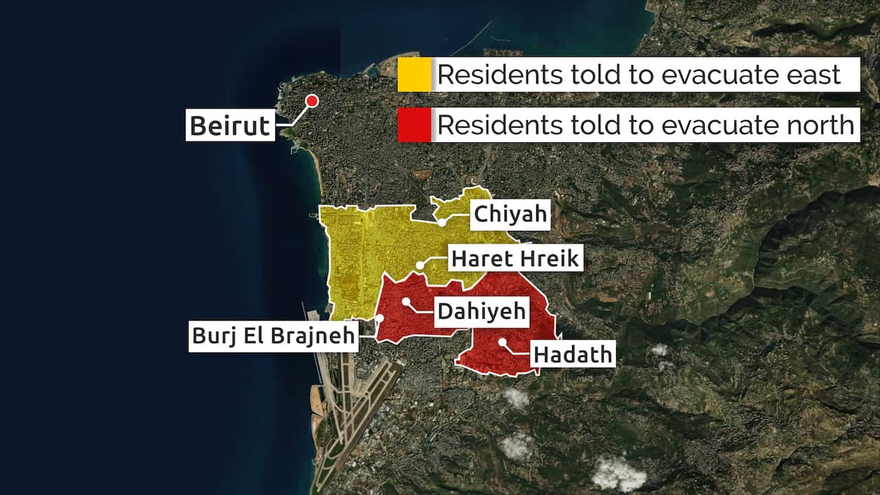 An aerial map of Beirut's southern suburbs showing Haret Hreik in yellow (evacuate east) and Dahiyeh, Hadath, and Burj El Brajneh in red (evacuate north).