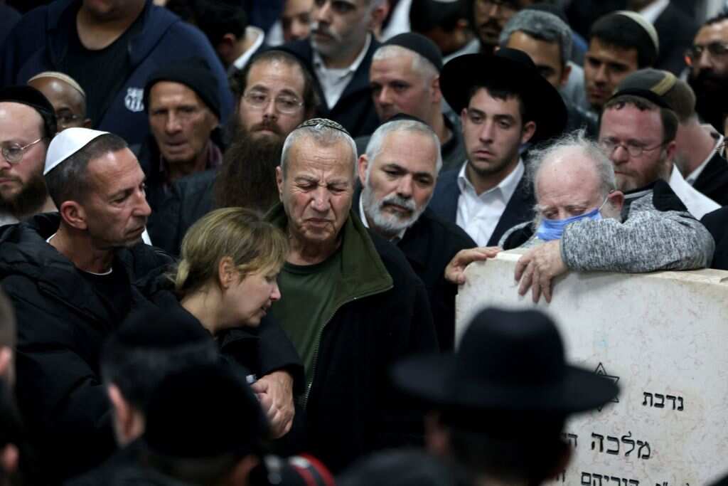 Mourners gather during the funeral of Eli Mizrahi and his wife, Natalie, who were victims of a shooting attack in east Jerusalem on January 27, 2023, in Bet Shemesh, Israel.