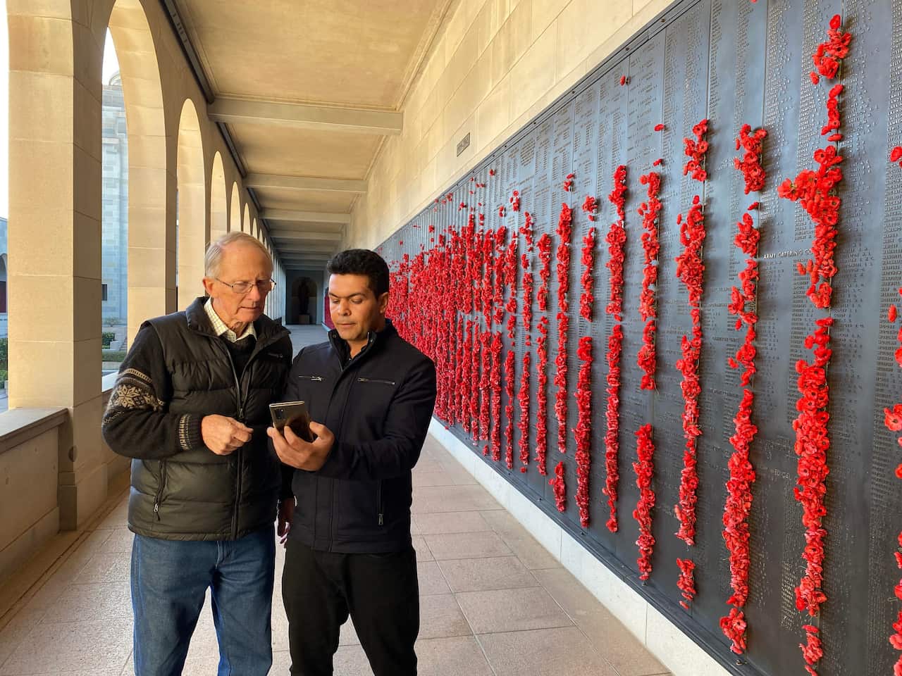 Hugh Poate meeting Farid Raman for the first time at the Australian War Memorial in Canberra.
