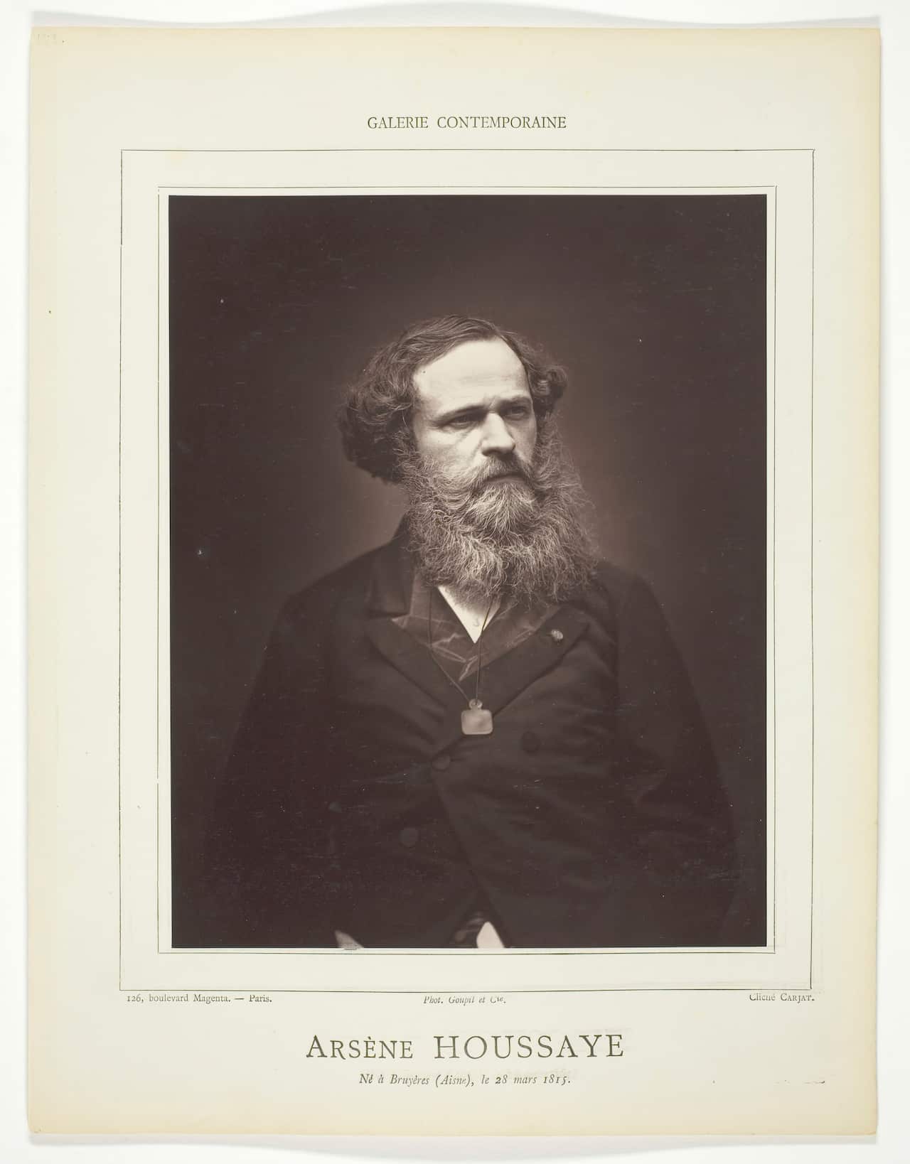 A black and white photo of a man with a beard